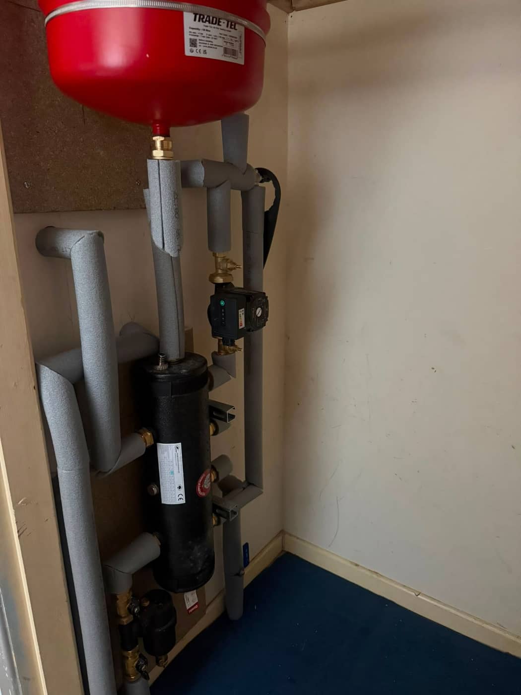 Pipework and a separator fitted inside a heating cupboard